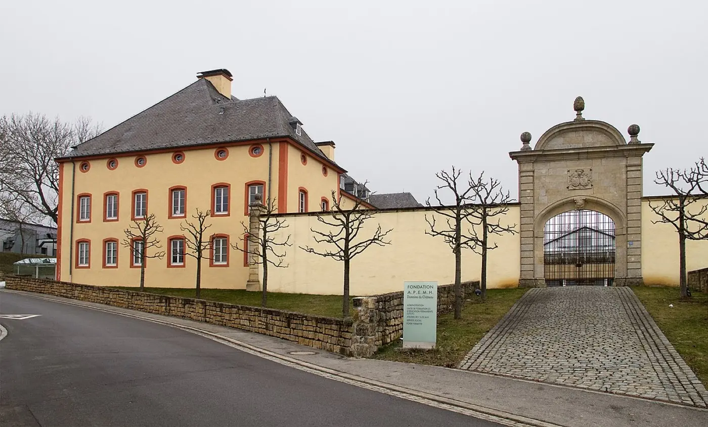 Historic facade and architectural details of Bettange-sur-Mess Castle in Luxembourg City, Luxembourg