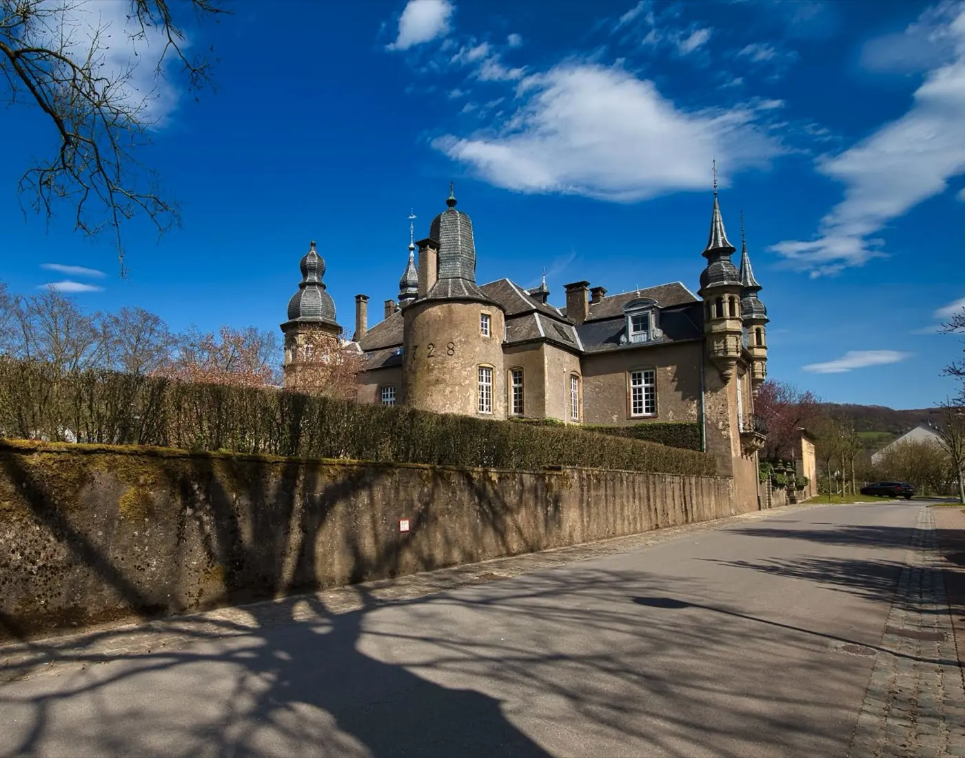 Historic facade and architectural details of Bettendorf Castle in Bettendorf, Luxembourg