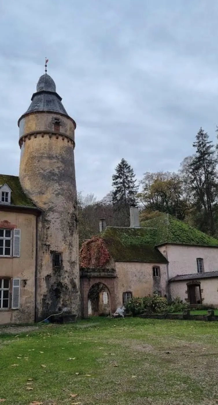 Historic facade and architectural details of Birtrange Castle in Birtrange, Luxembourg