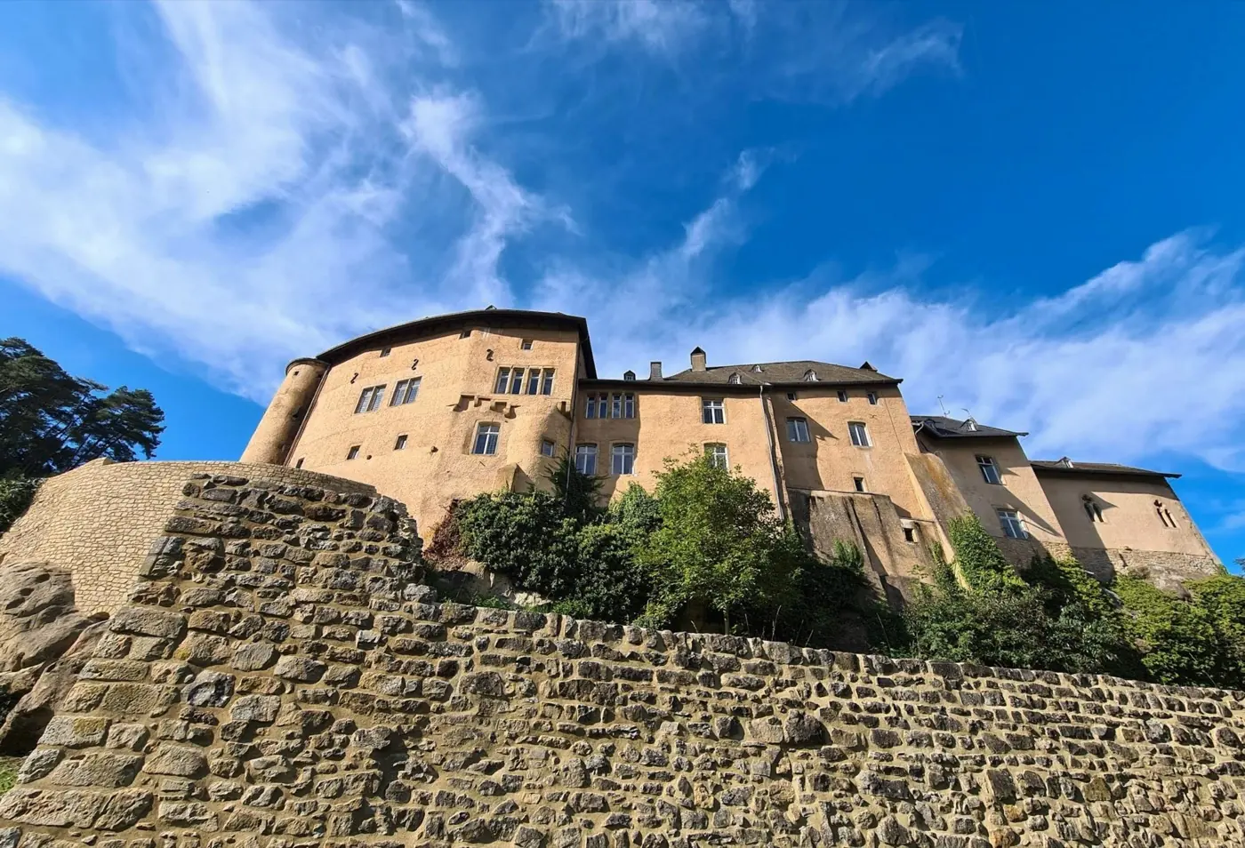 Approach to Bourglinster Castle showing its setting in Bourglinster, Luxembourg