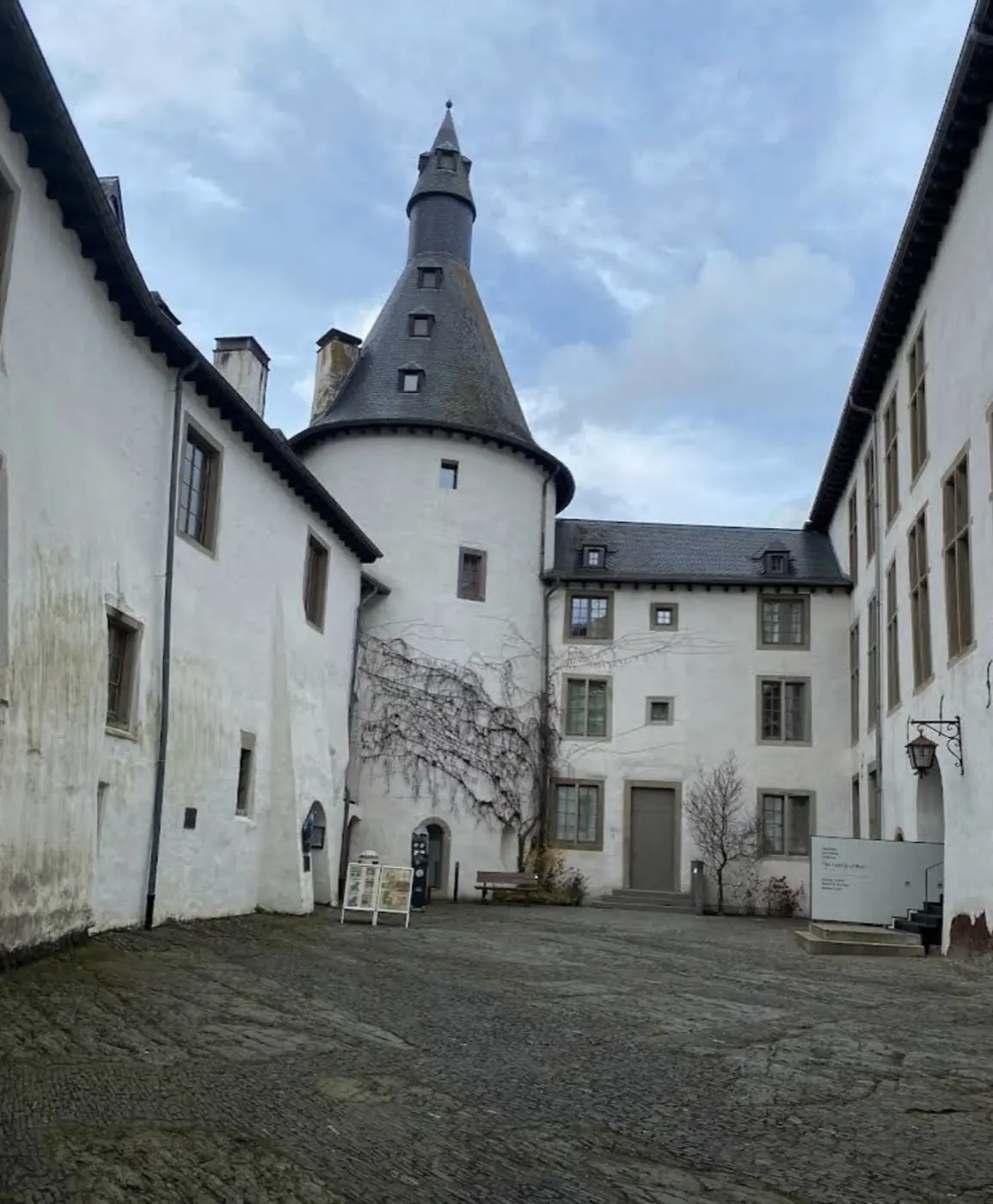 Approach to Clervaux Castle showing its setting in Clervaux, Luxembourg