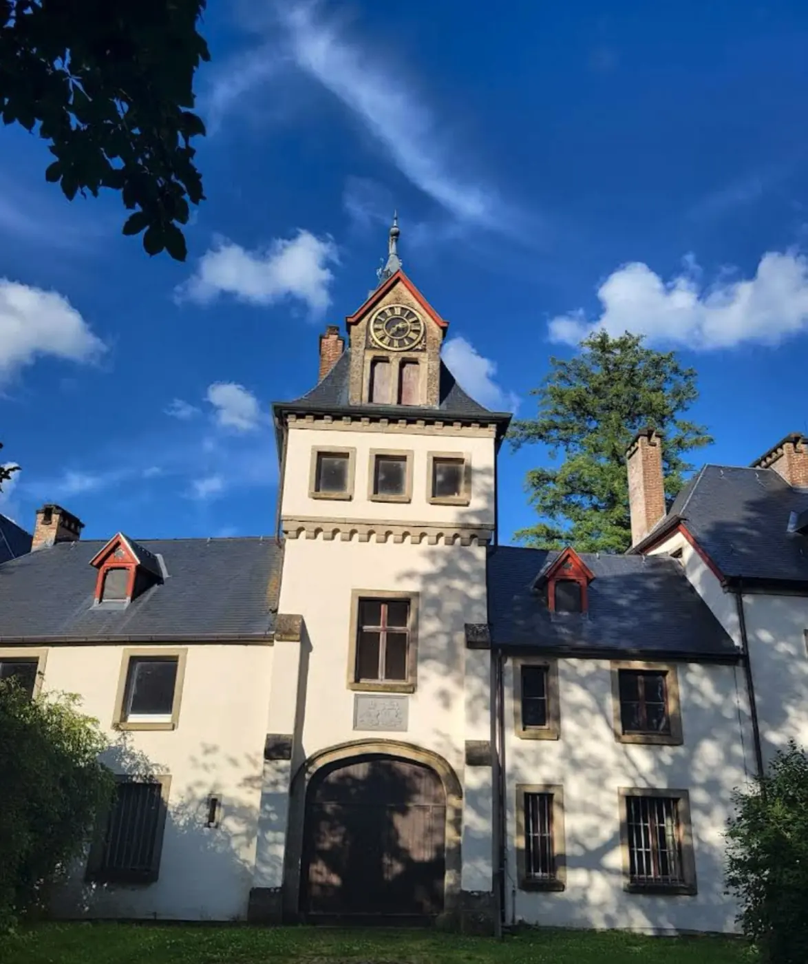 Approach to Meysembourg Castle showing its setting in Larochette, Luxembourg
