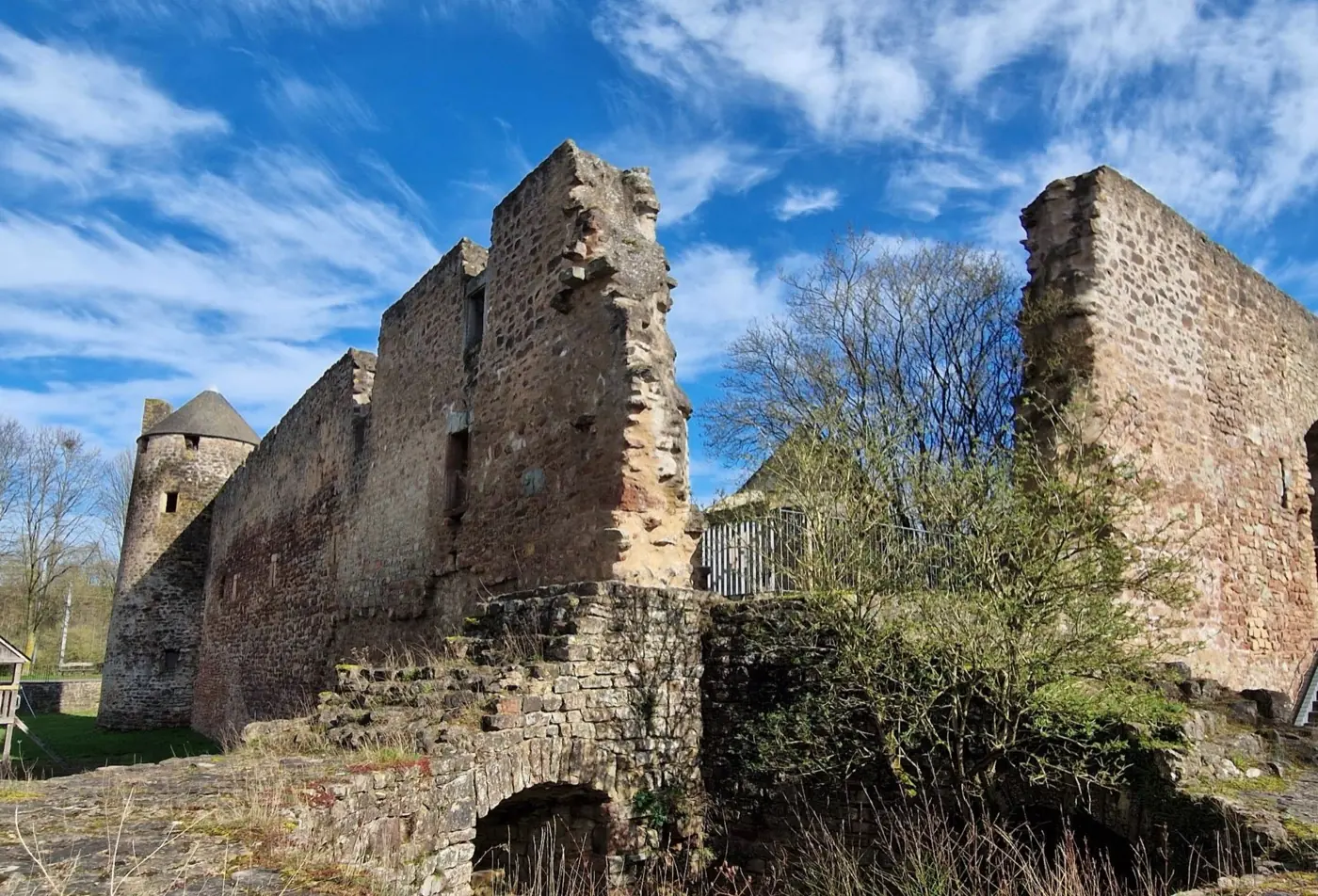 Exterior view of Pettingen Castle, a ruin in Pettingen, Luxembourg