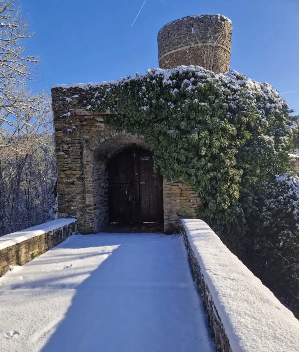 Historic facade and architectural details of Schuttbourg Castle in Kiischpelt, Luxembourg