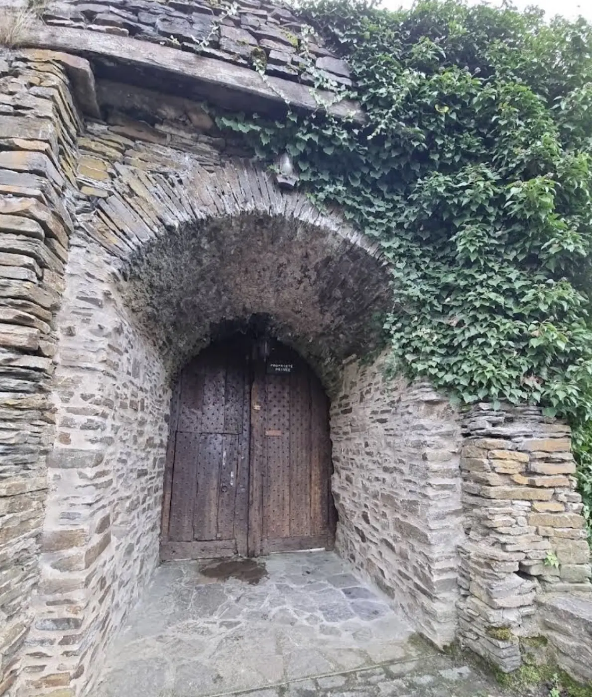 Approach to Schuttbourg Castle showing its setting in Kiischpelt, Luxembourg