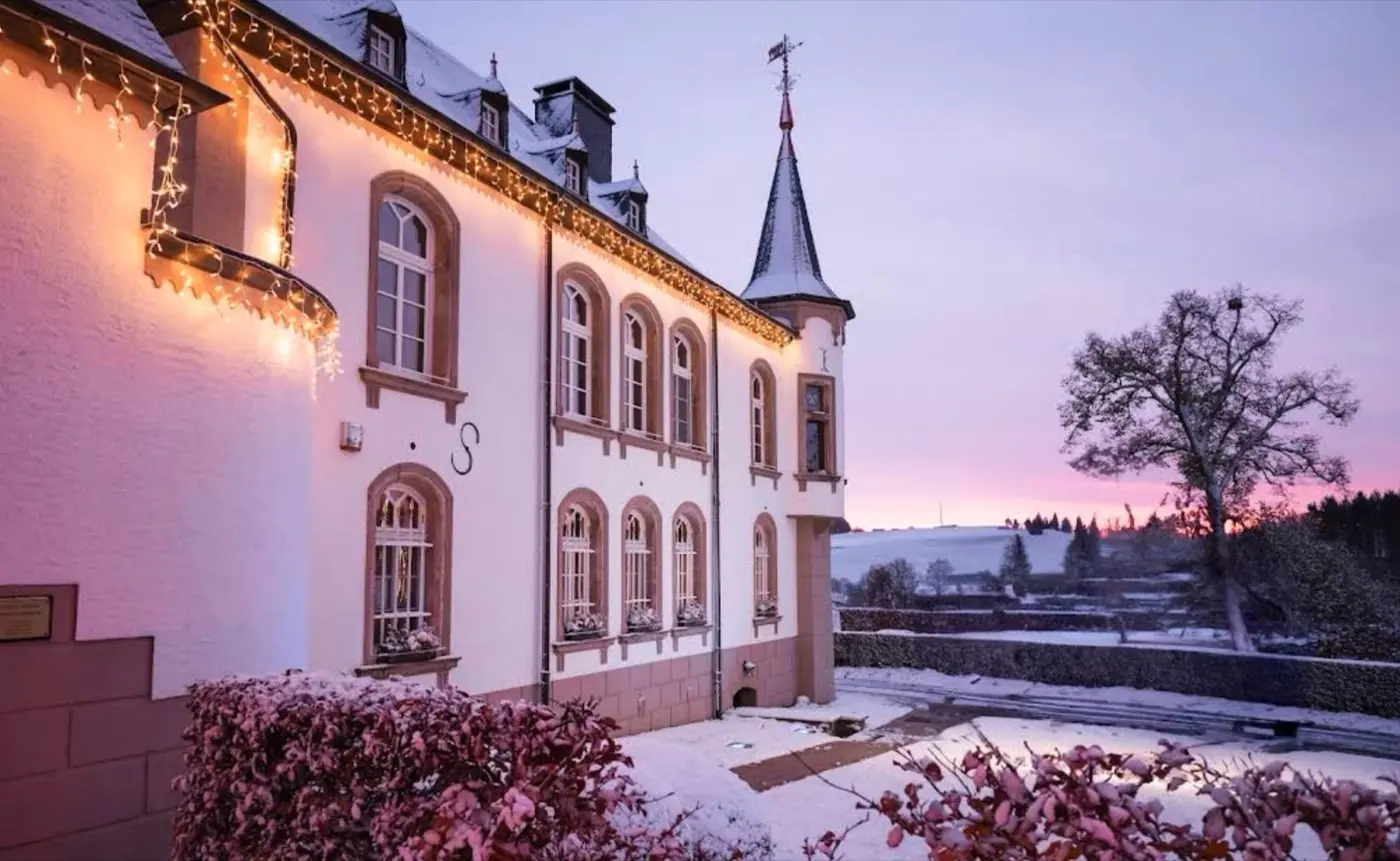 Historic facade and architectural details of Urspelt Castle in Urspelt, Luxembourg