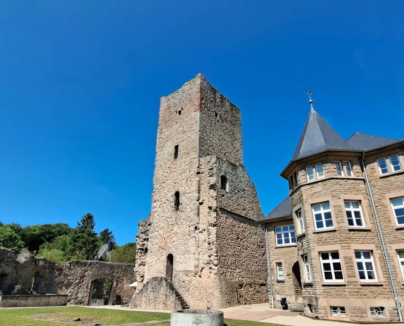 Approach to Useldange Castle showing its setting in Useldange, Luxembourg