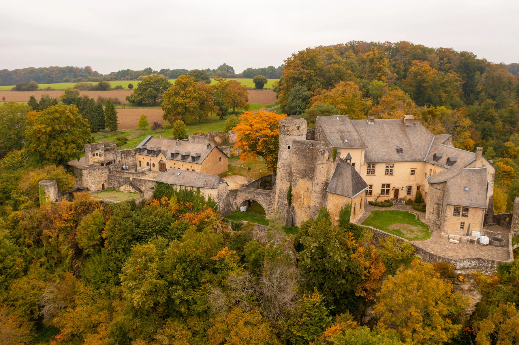 Aerial view of Ansembourg Castle and the Eisch Valley
